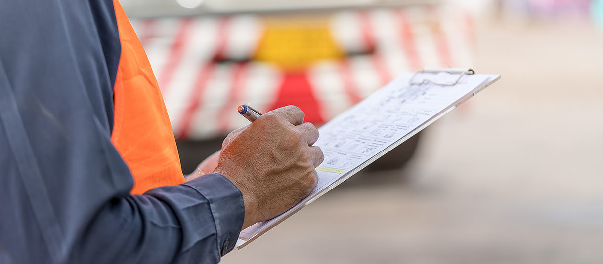 AVIN employee writing on paper